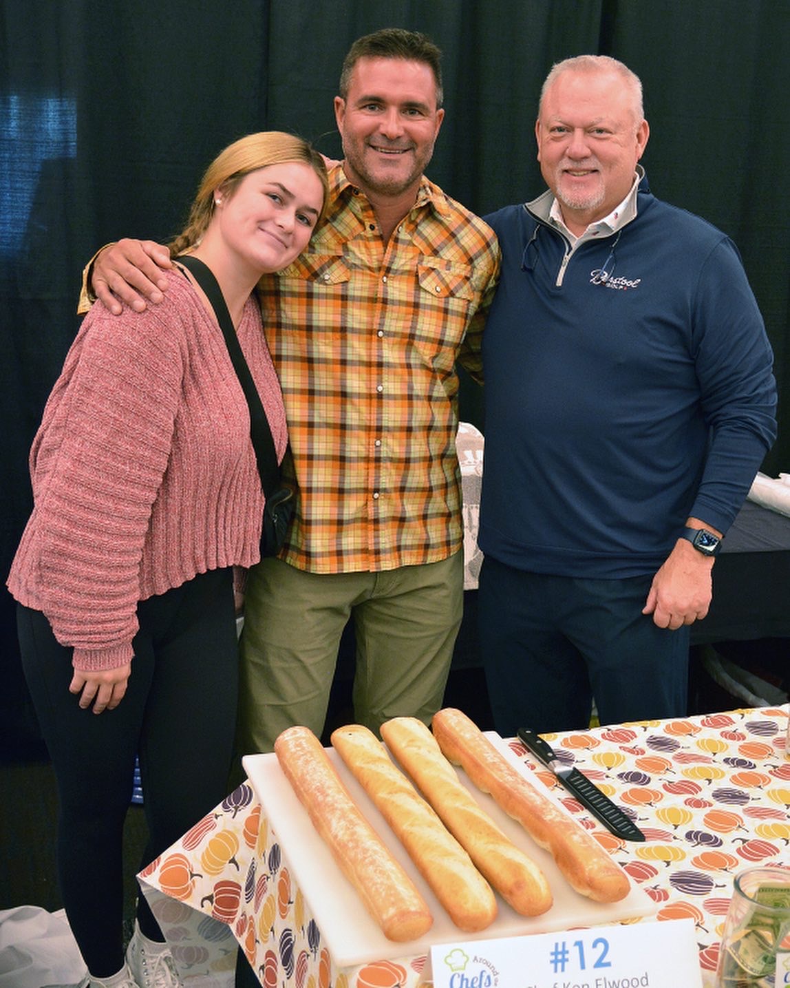 Dr. Levenda and two other people smiling for the camera