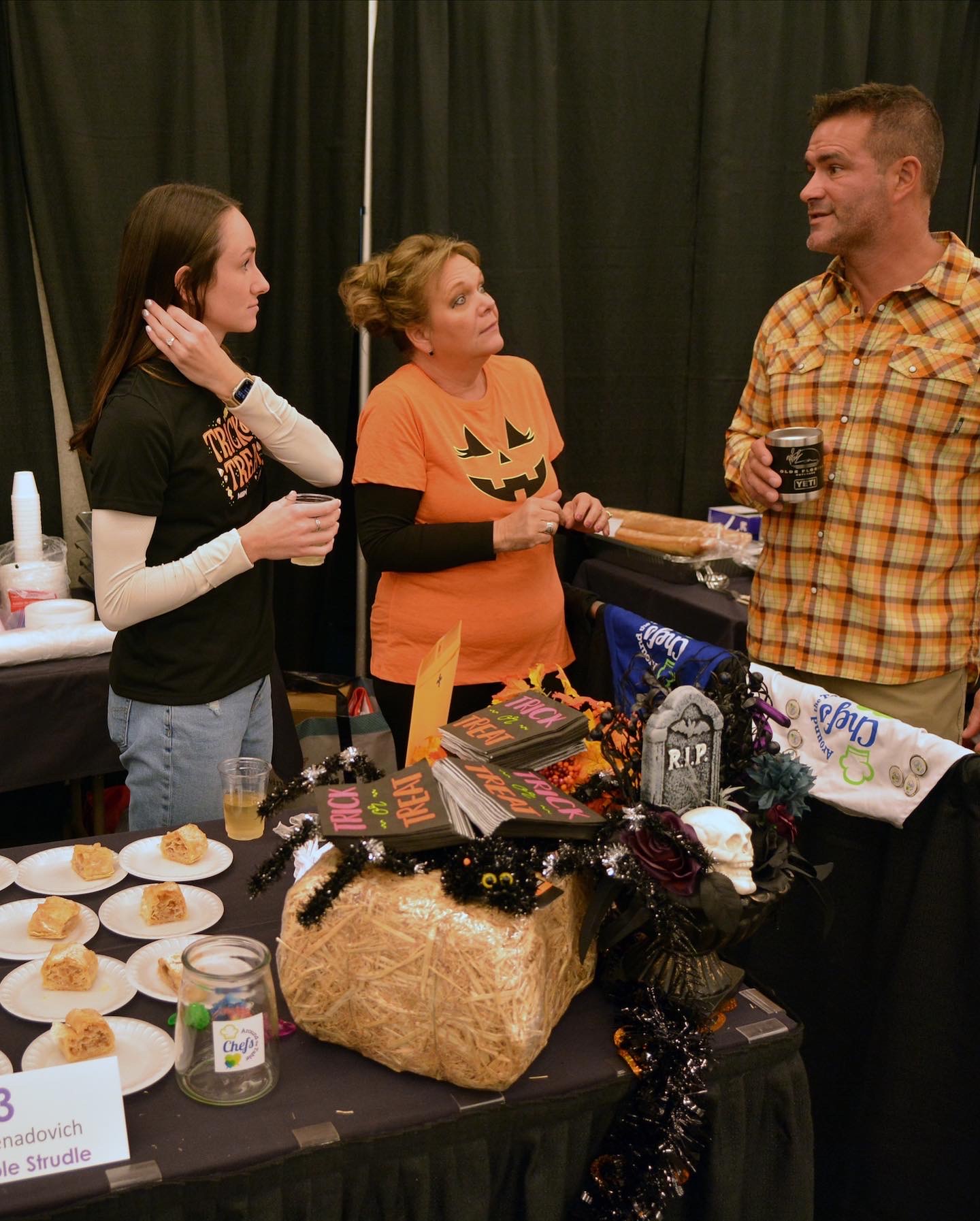 Dr. Levenda talking with two ladies